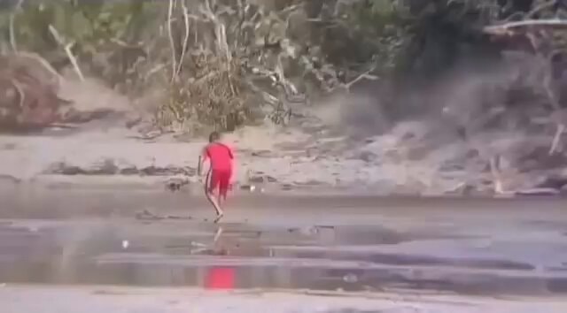 person running through muddy water