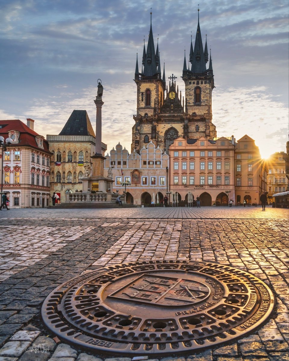 Prague cobblestone plaza sunrise