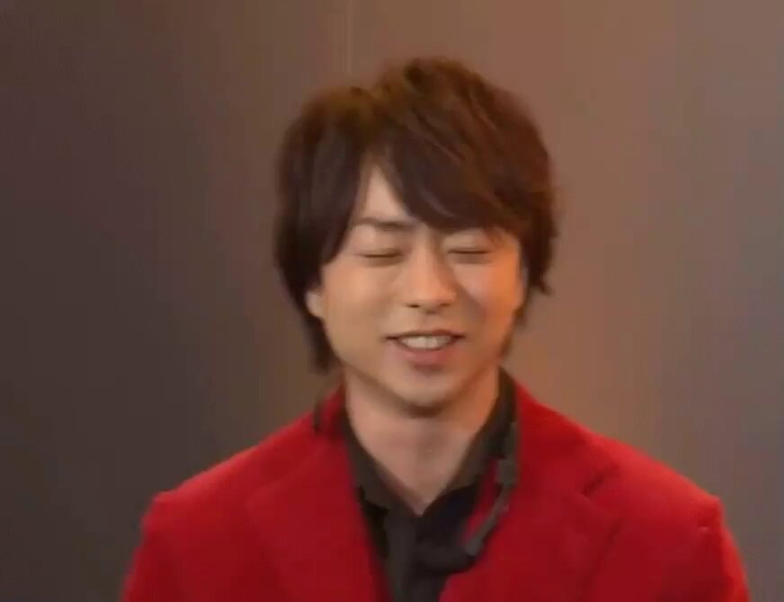 man in red blazer laughing