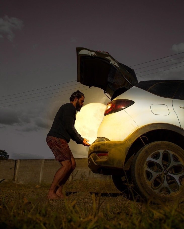 man holding glowing moon orb (photo 2 of 3)