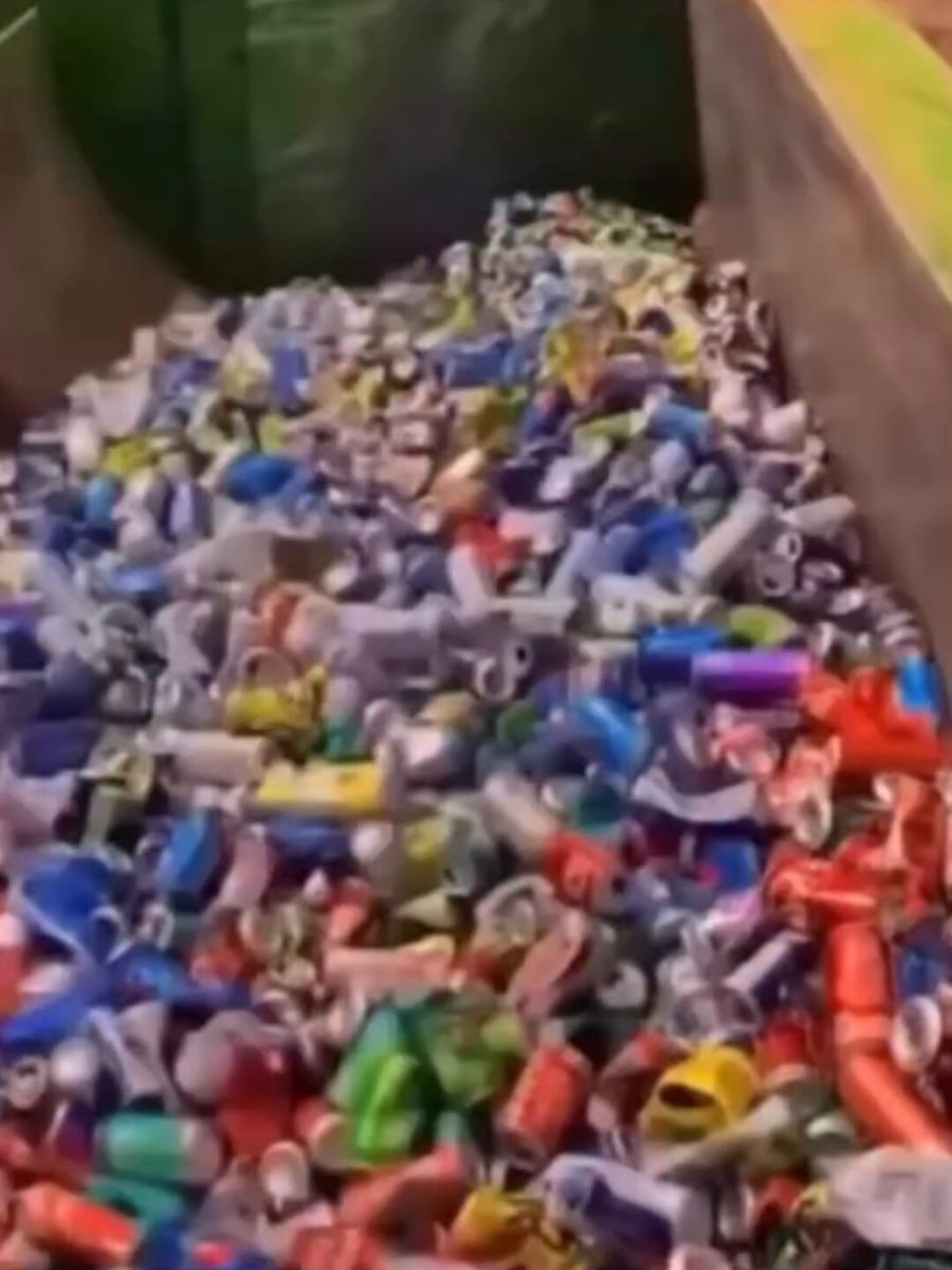18,000 aluminum cans compressed