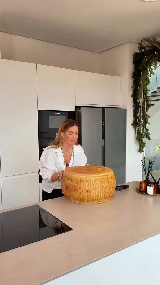 Parmigiano-Reggiano wheel in kitchen