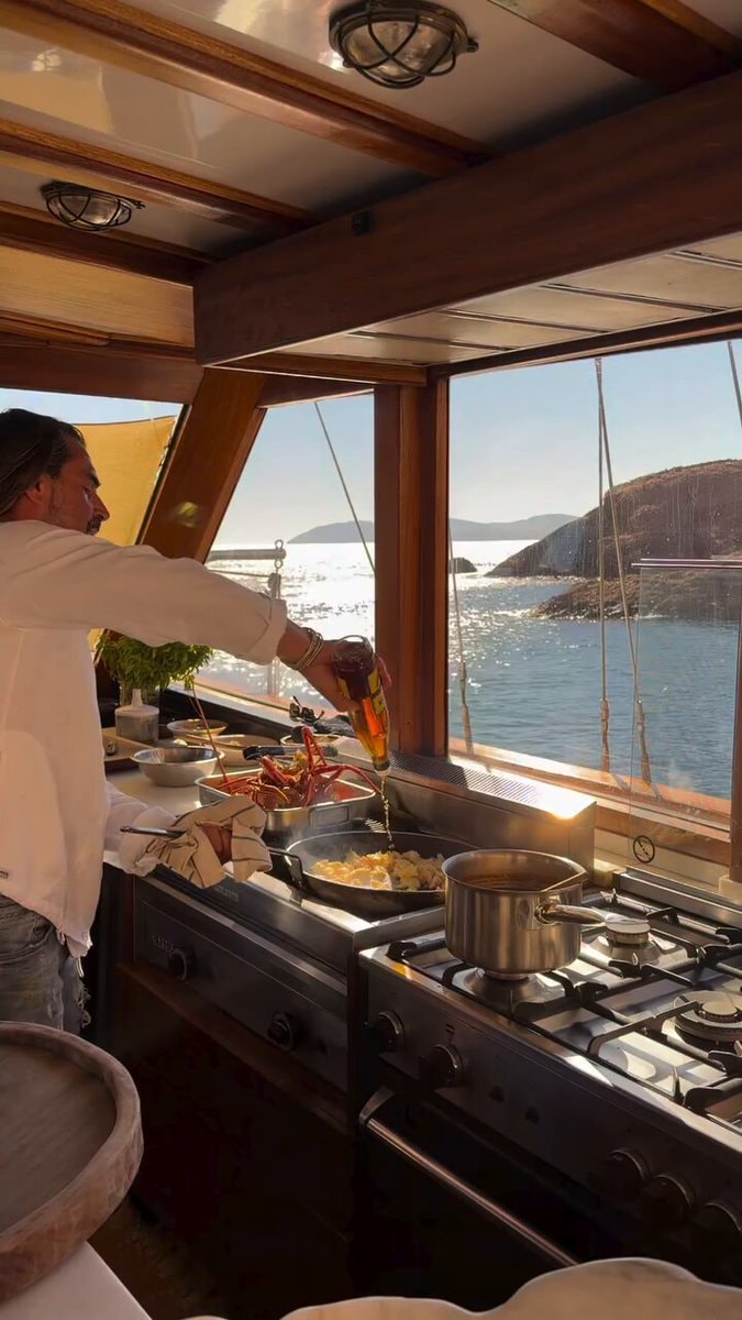 man cooking on boat