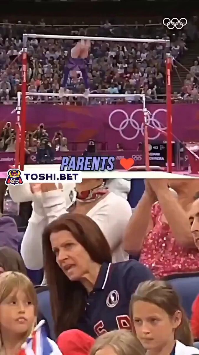 Gymnast on uneven bars at competition