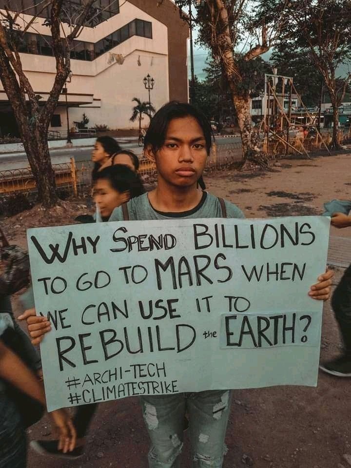 Climate Strike sign about Mars money
