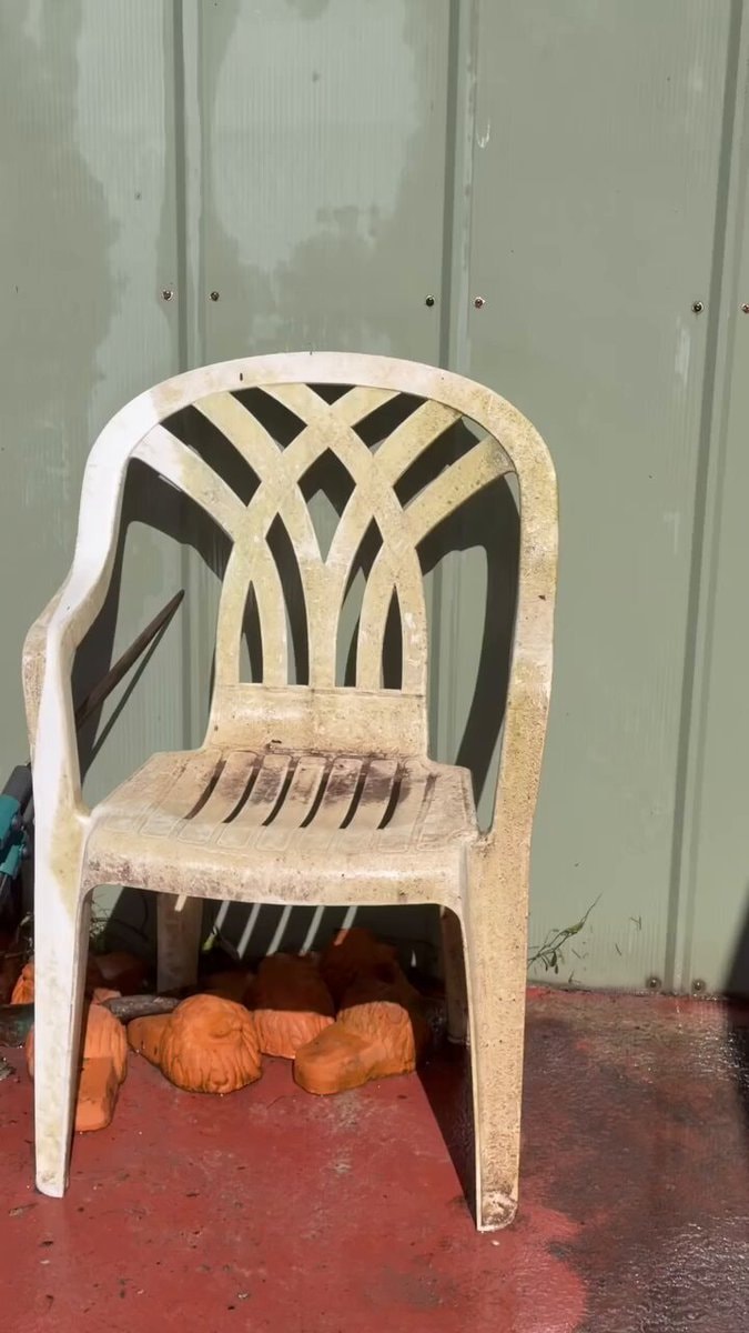Weathered white plastic chair