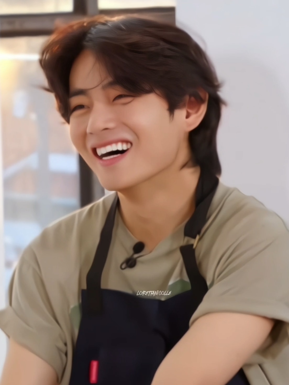 Tae laughing heartily