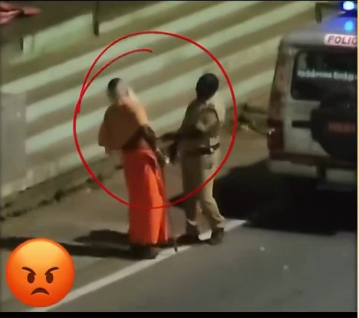 Police officer apprehending individual
