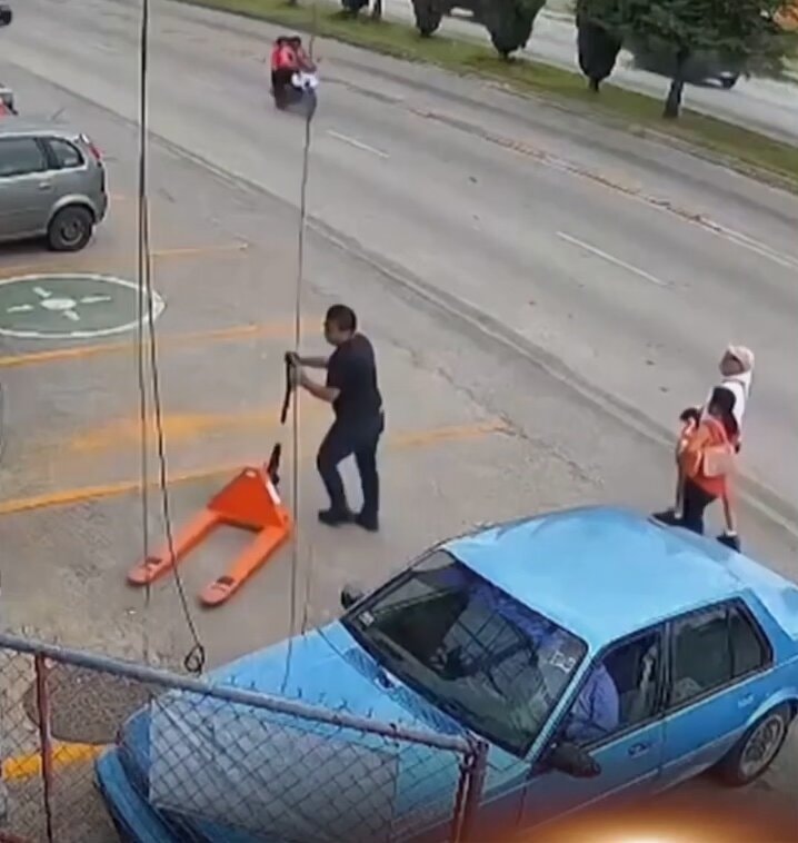 man operating a pallet jack