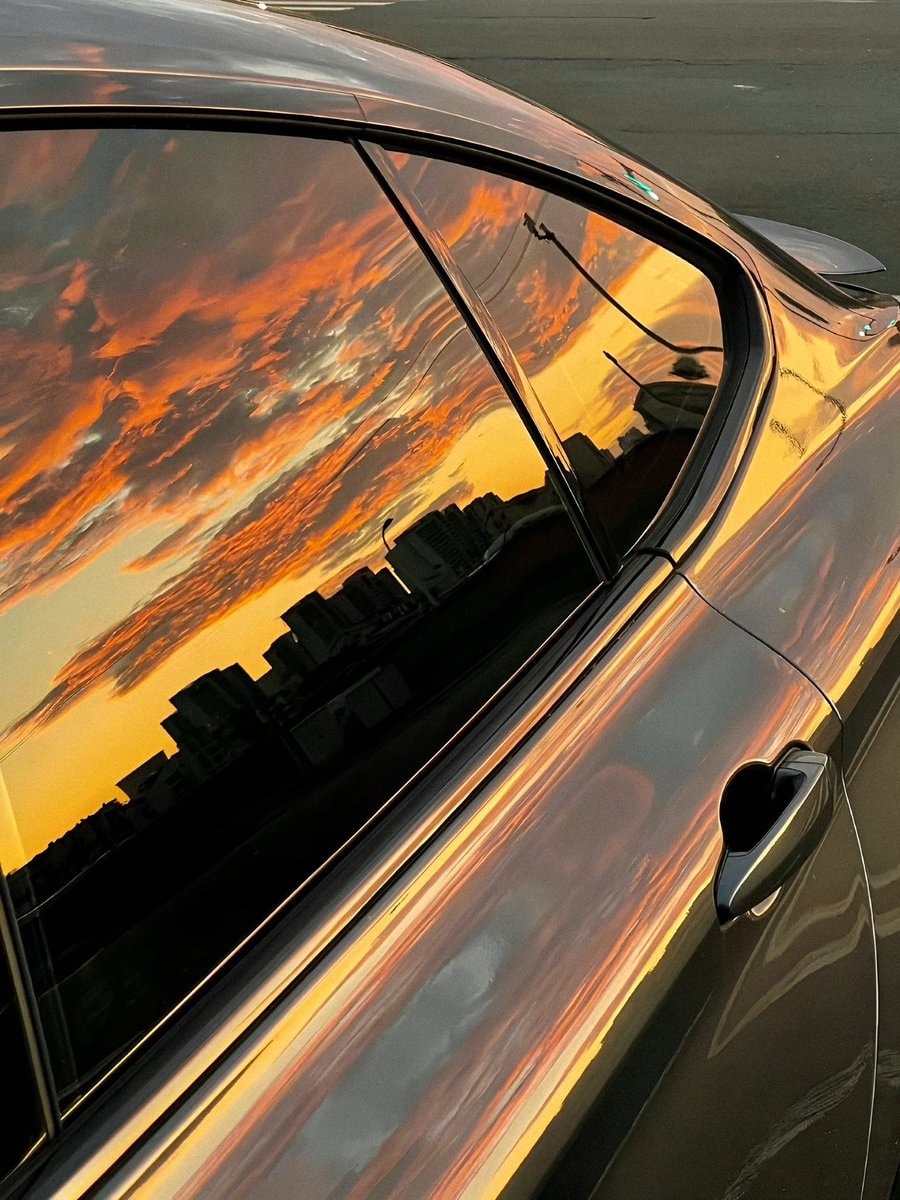 Sunset view reflection on car