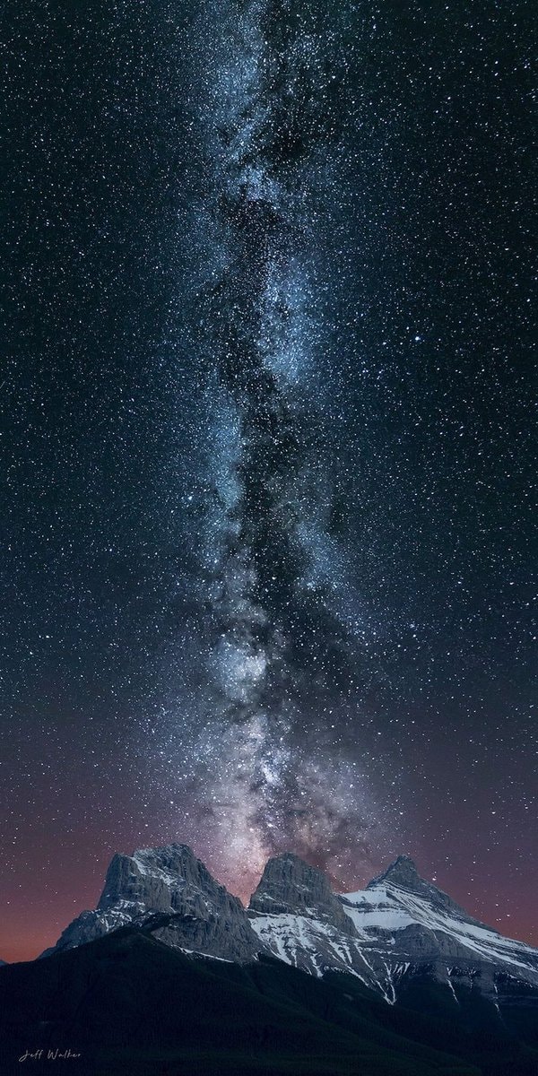 Milky Way over snow-capped mountains by Jeff Walker Milky Way over snow-capped mountains by Jeff Walker