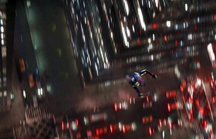 Spider-Man swinging through city at night