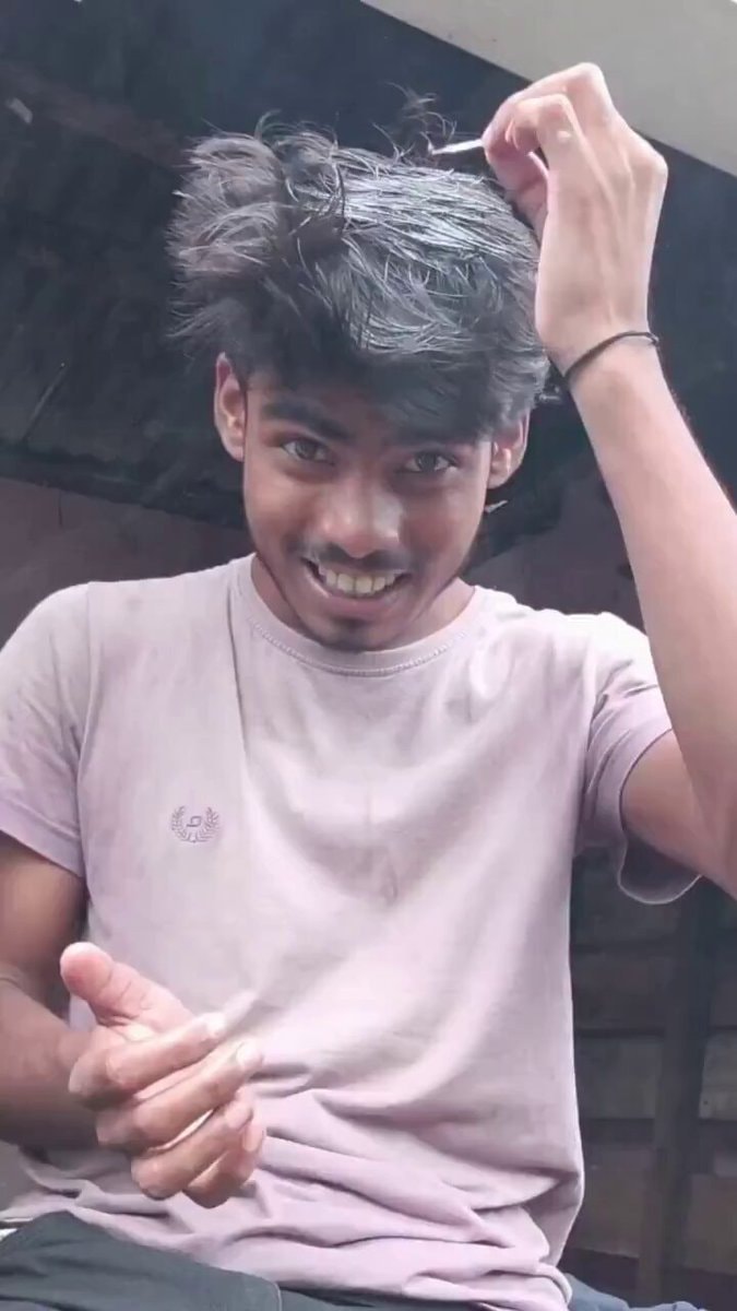Young man styling hair