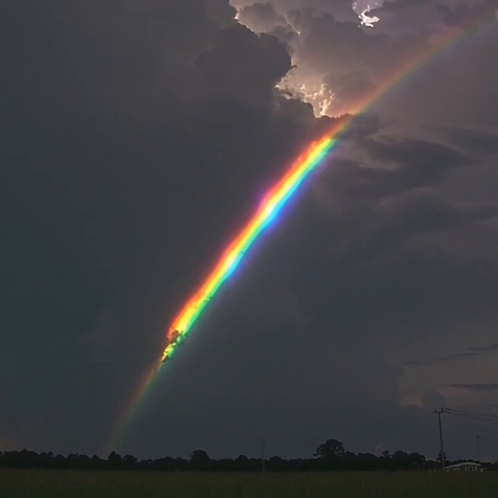 Rainbow over dark sky
