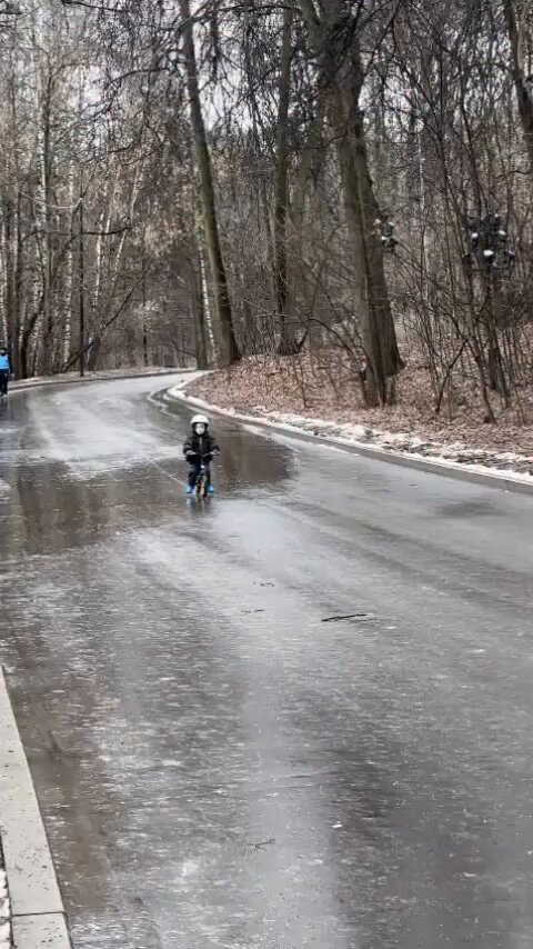 child on balance bike