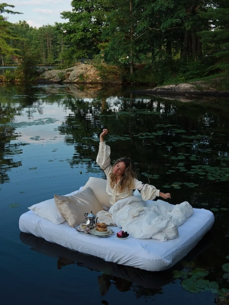 woman stretching on floating mattress