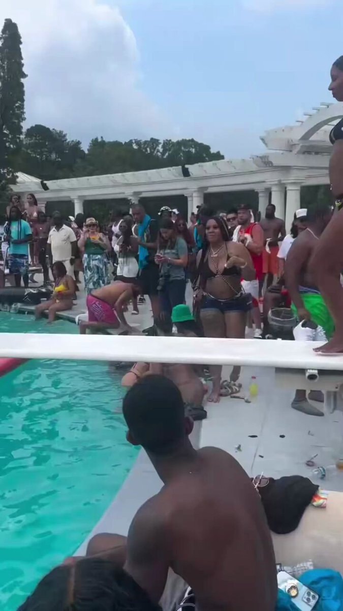 Woman lighting up outdoor pool party