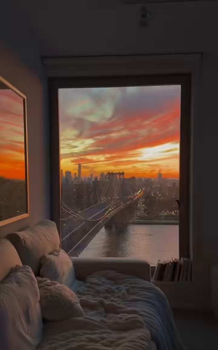 City sunset view from cozy living room