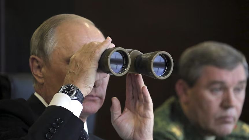 Putin looking through binoculars
