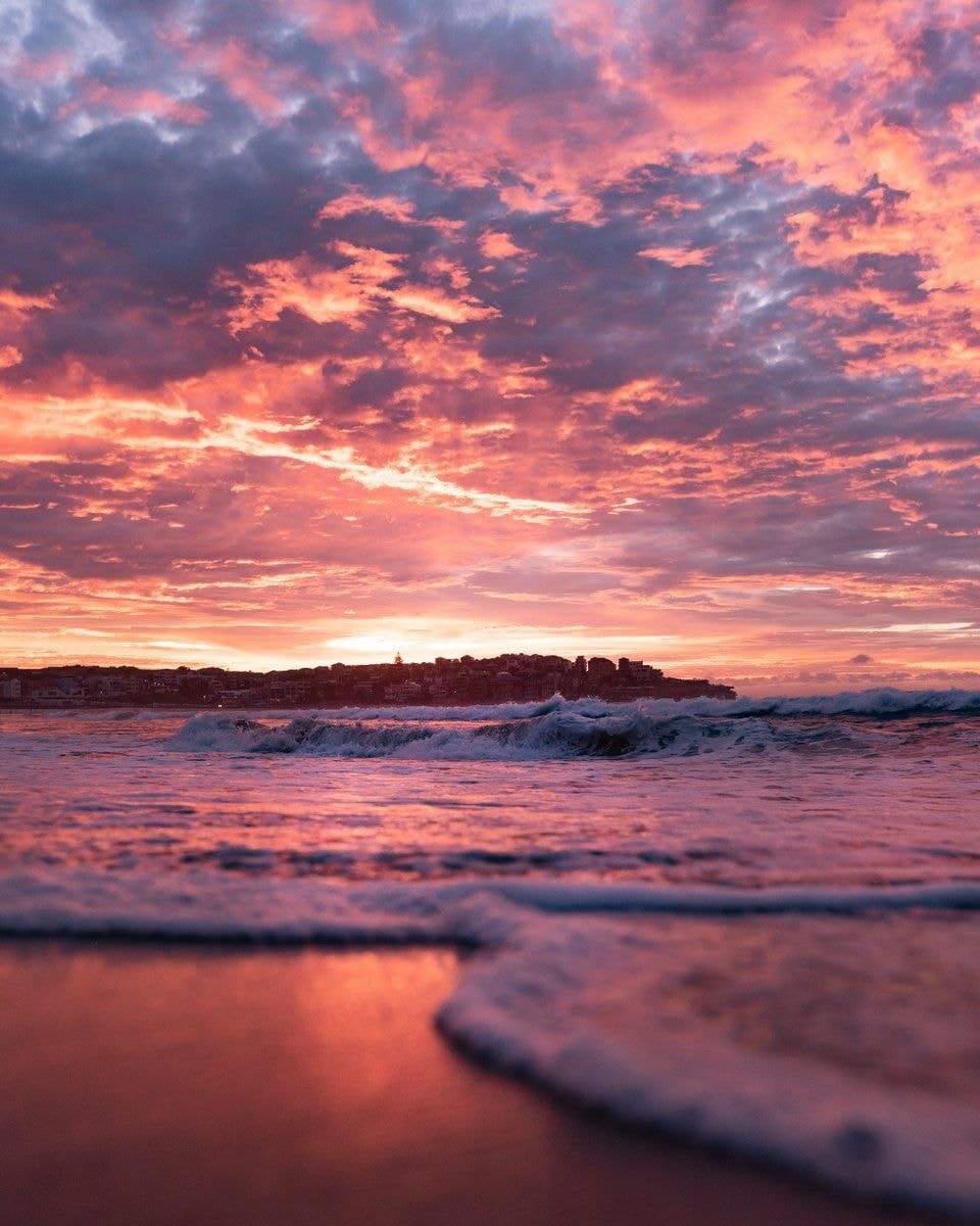 Sunset beach city skyline