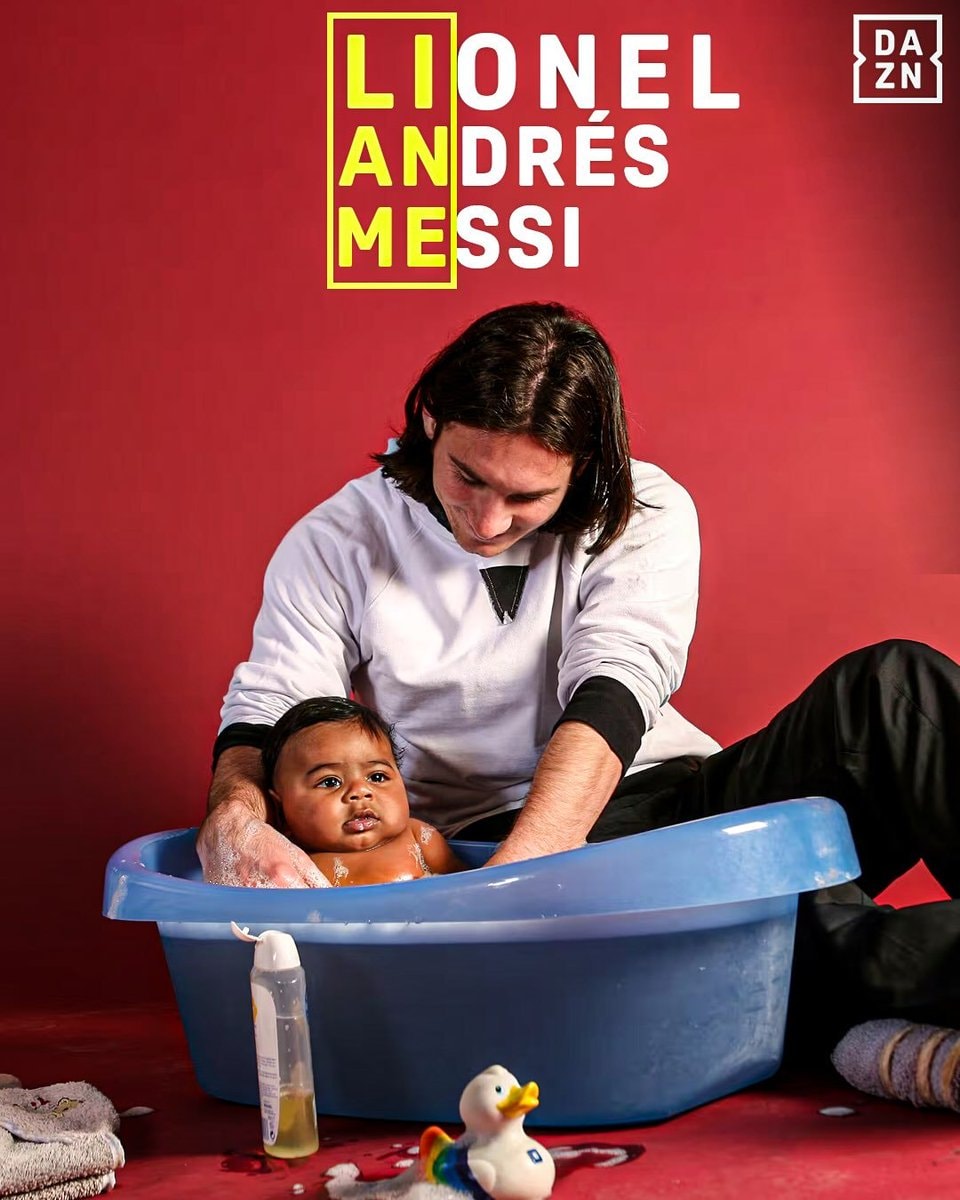 Messi bathing his baby