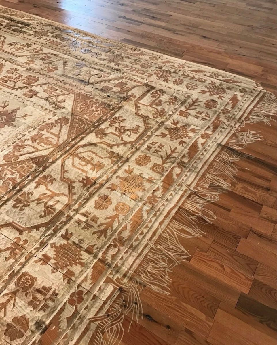 intricately carved rug (photo 3 of 3)