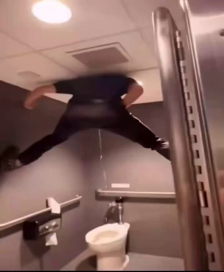person jumping over toilet