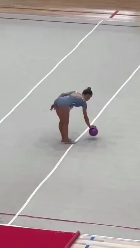 Rhythmic gymnast purple ball routine