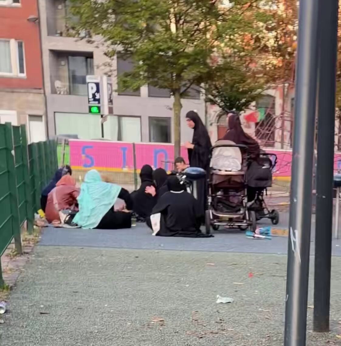 Migrant women and children in urban park