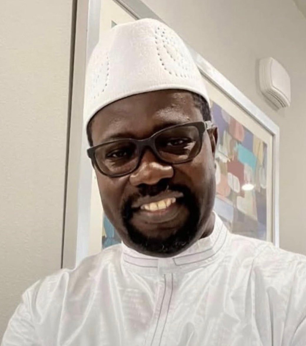 Usman Sisey white kufi glasses
