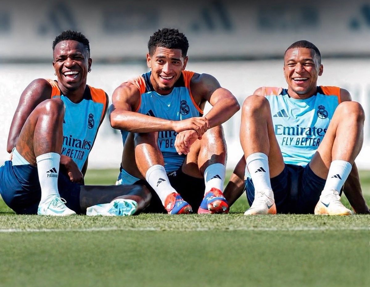 soccer players laughing on the grass