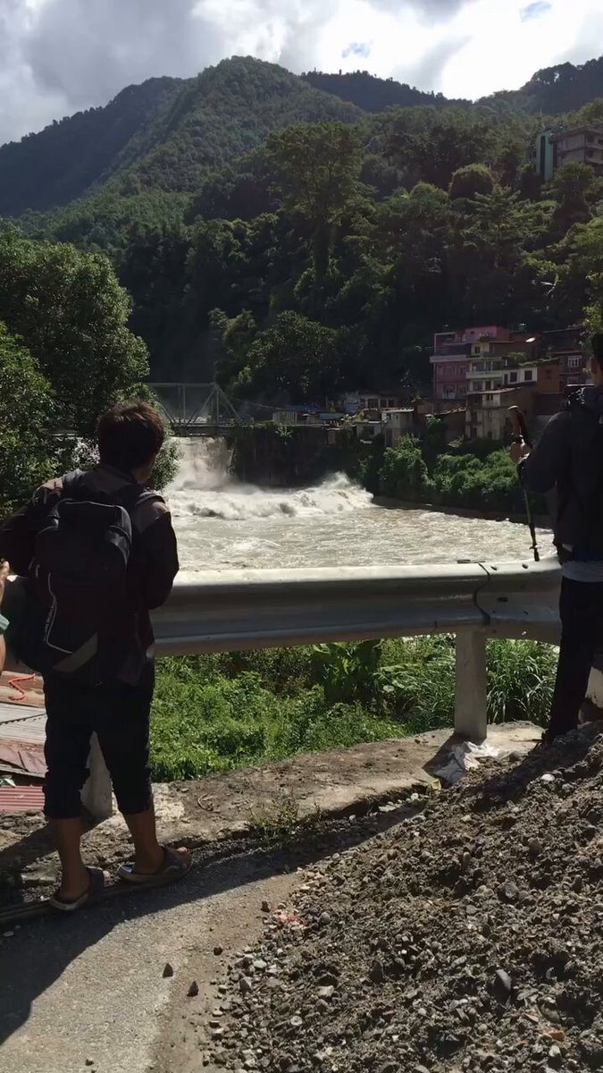 Nepal flood watchers narrow escape camera angle