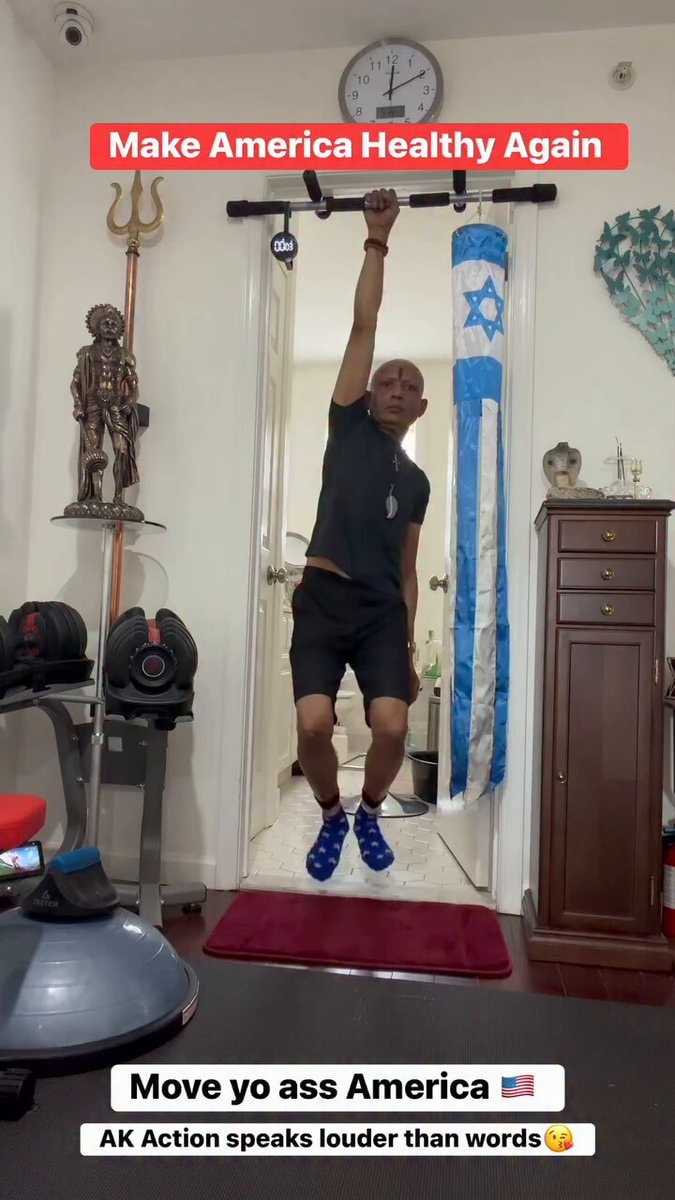 Man doing pull ups with Israeli flag