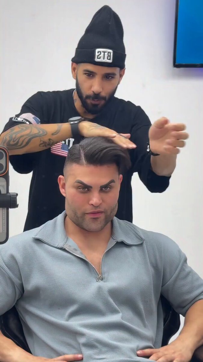 Man getting hair styled