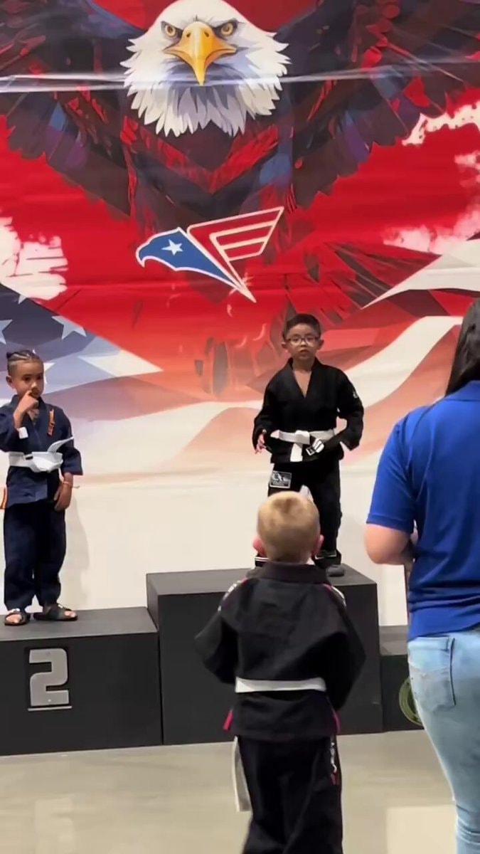 Kids on jiu-jitsu podium
