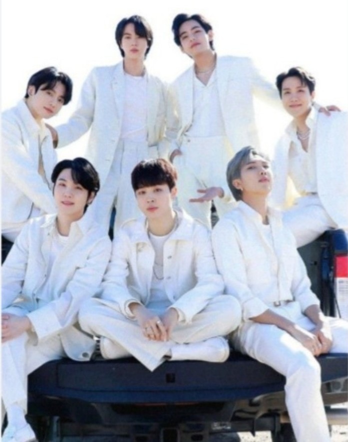 BTS members with ARIRANG album artwork (photo 1 of 2)