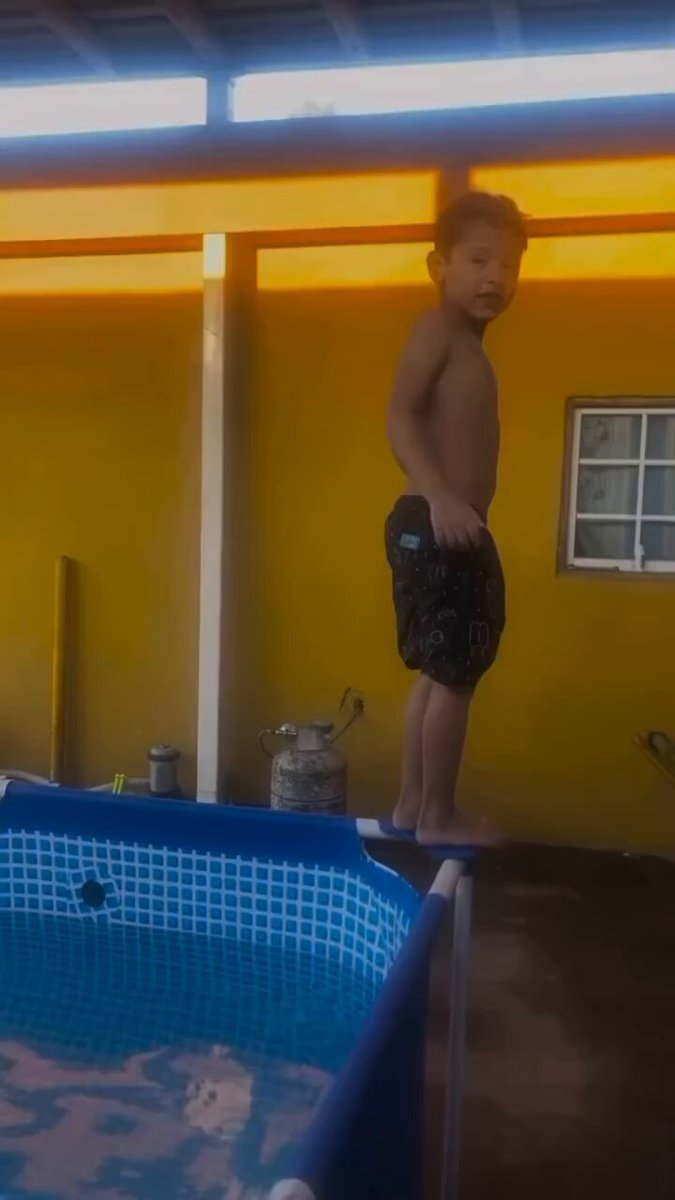 young boy by pool