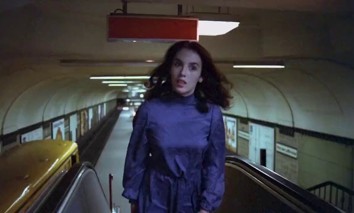 woman on subway escalator startled