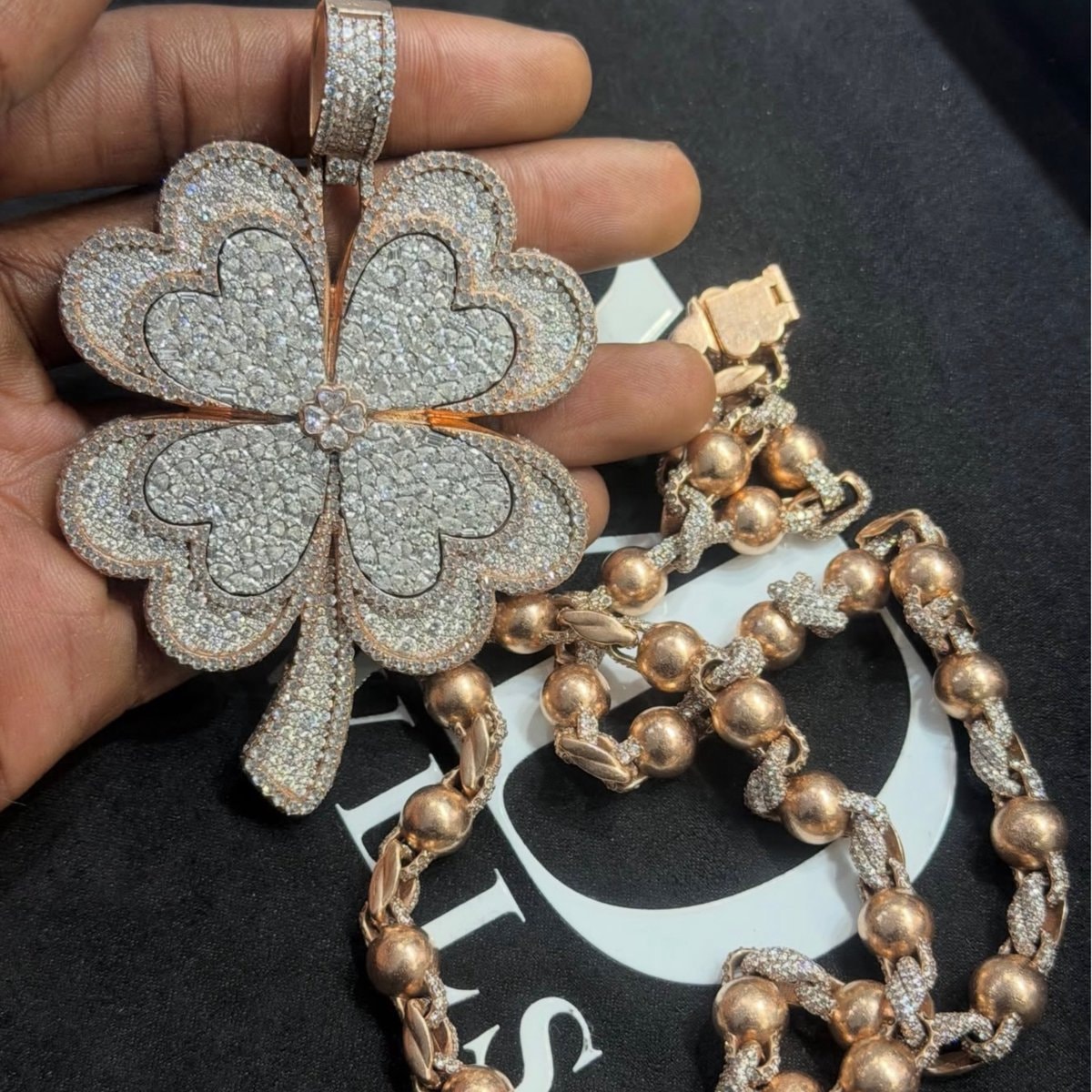 Cuffem buying Reggie's Clover chain (photo 2 of 2)