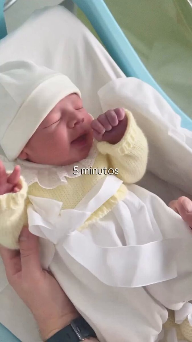 Newborn in yellow outfit