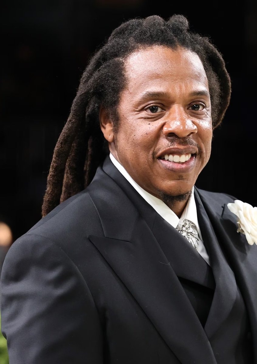 Jay-Z smiling at formal event