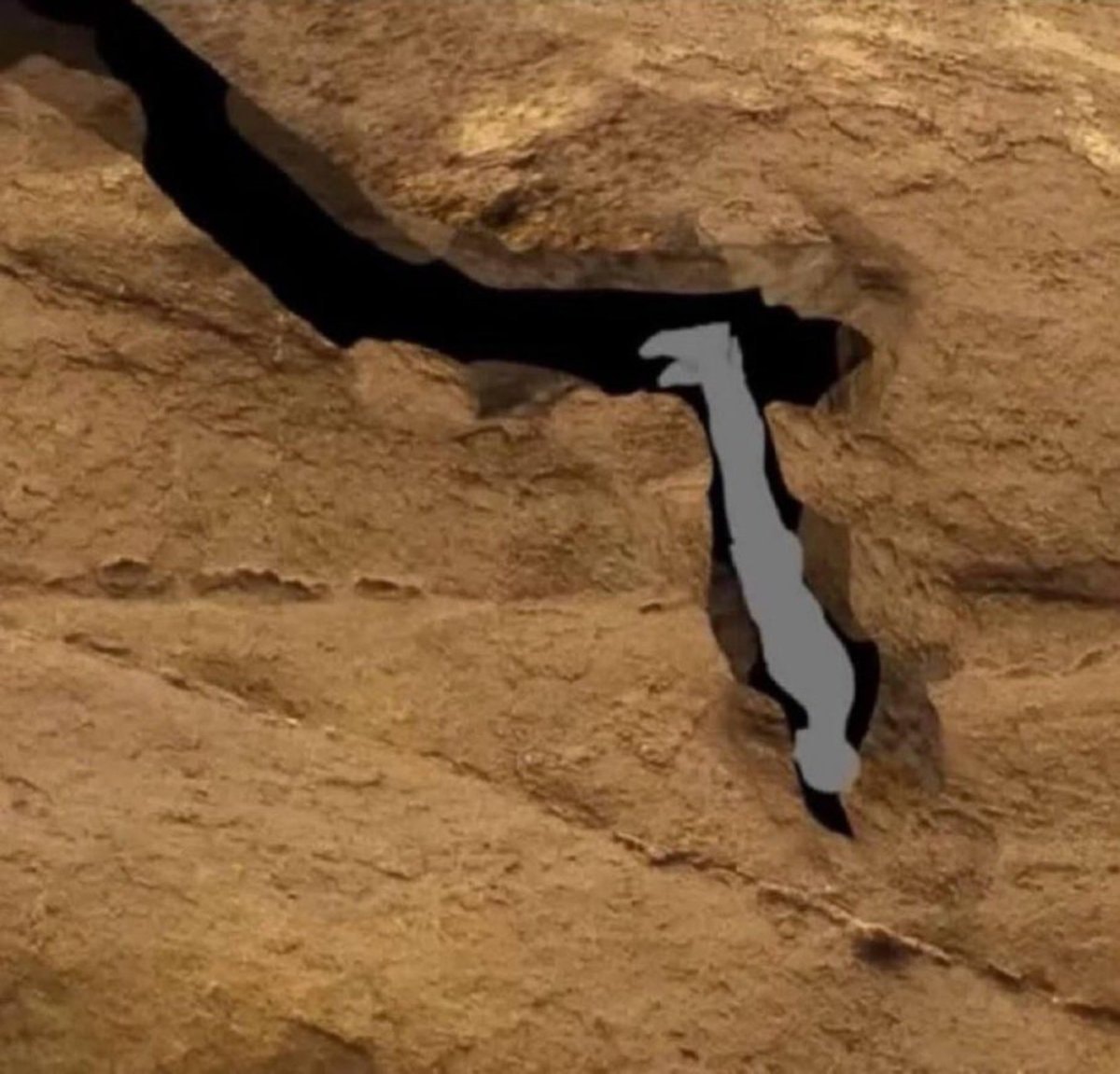 Rock formation with dark crevice