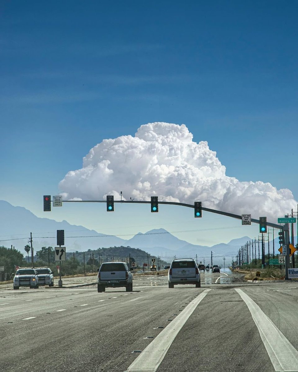 Massive cloud over busy intersection