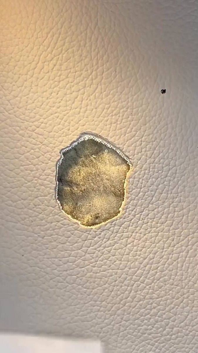 Torn faux leather surface