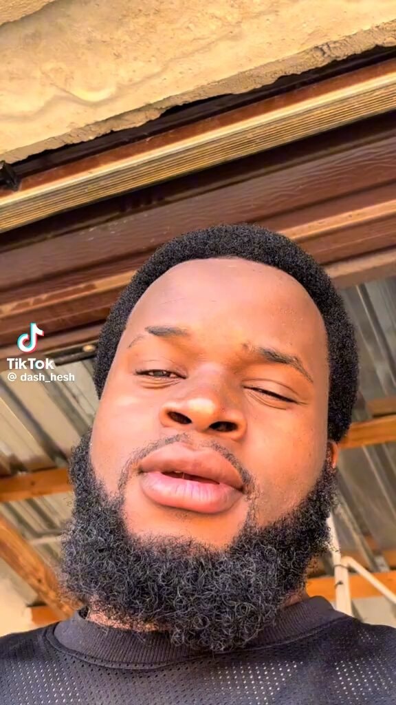 man winking and kissing face