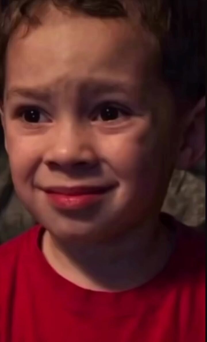 boy apologizes while laughing