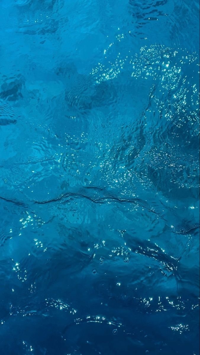 peaceful ocean scene with sparkling waves (photo 3 of 3)