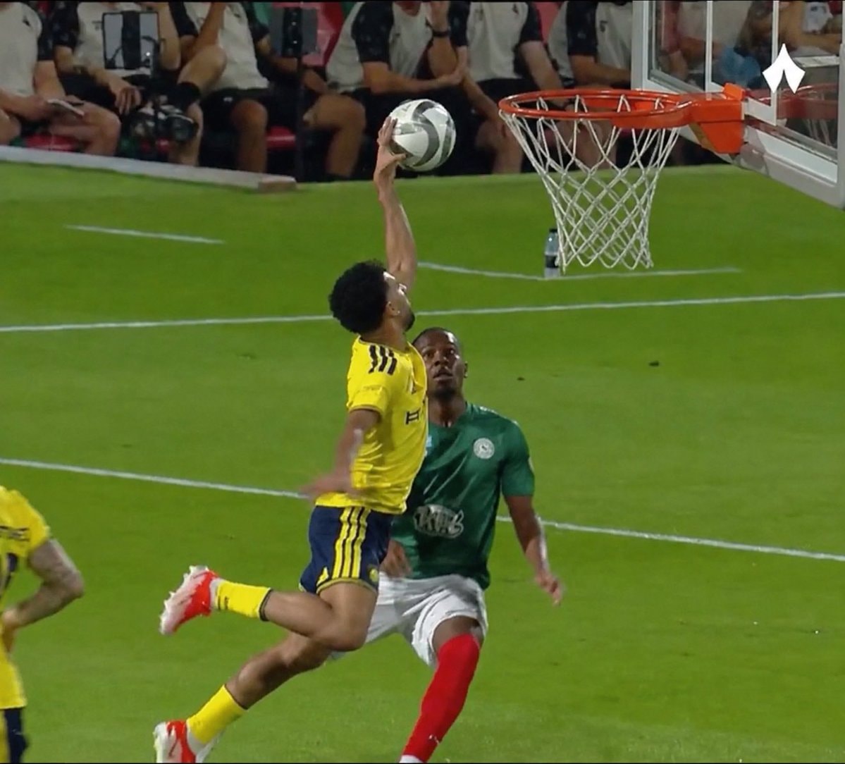 soccer player dunks ball