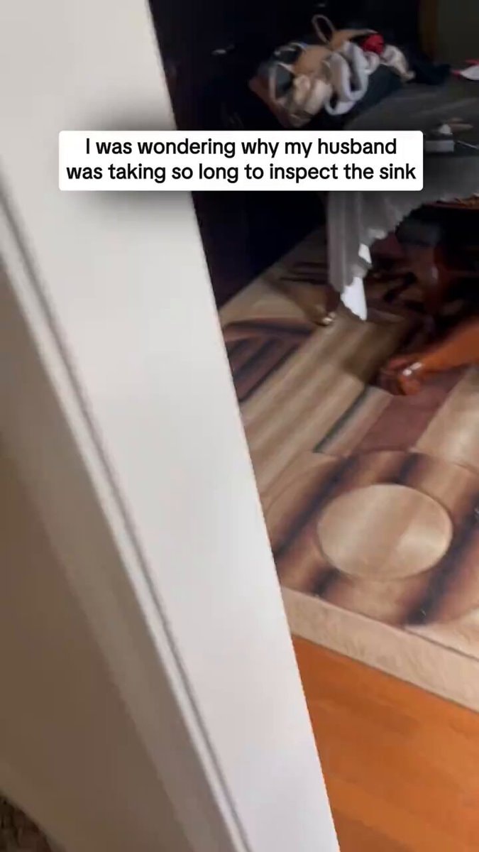 Husband takes a break under the sink