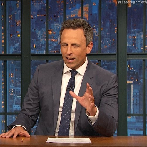Man in suit at desk reaction